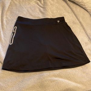 Black Fila sports skirt for golf/tennis size small. Reflective zippered pocket
